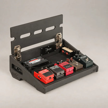 Core D340/450 Stealth Black pedalboard with the top deck lifted, showing the power supply stored underneath inside