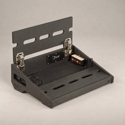 Core D340/450 Stealth Black pedalboard with the top deck lifted, showing the in/out connection panel inside
