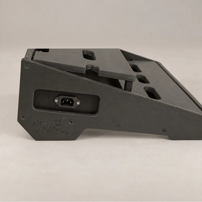 Integrated 230V power inlet in the wooden side panel of a Core D340/450 Stealth Black pedalboard