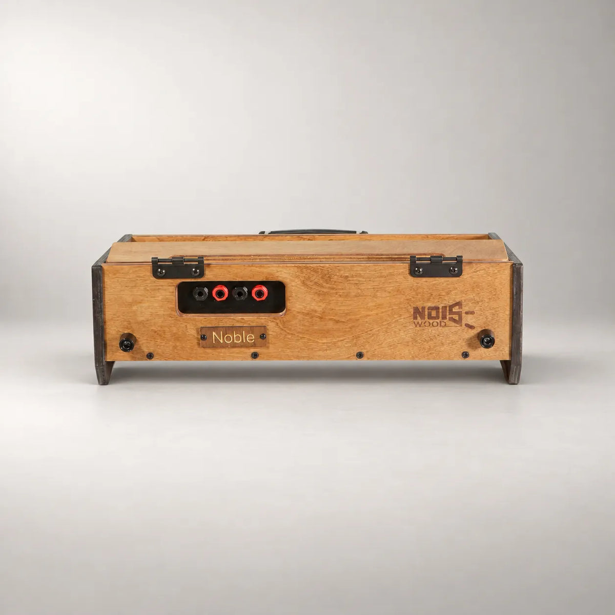 Rear panel of the Noisewood Noble D340/450-TM pedalboard with four TRS jacks and the engraved Noble name plate
