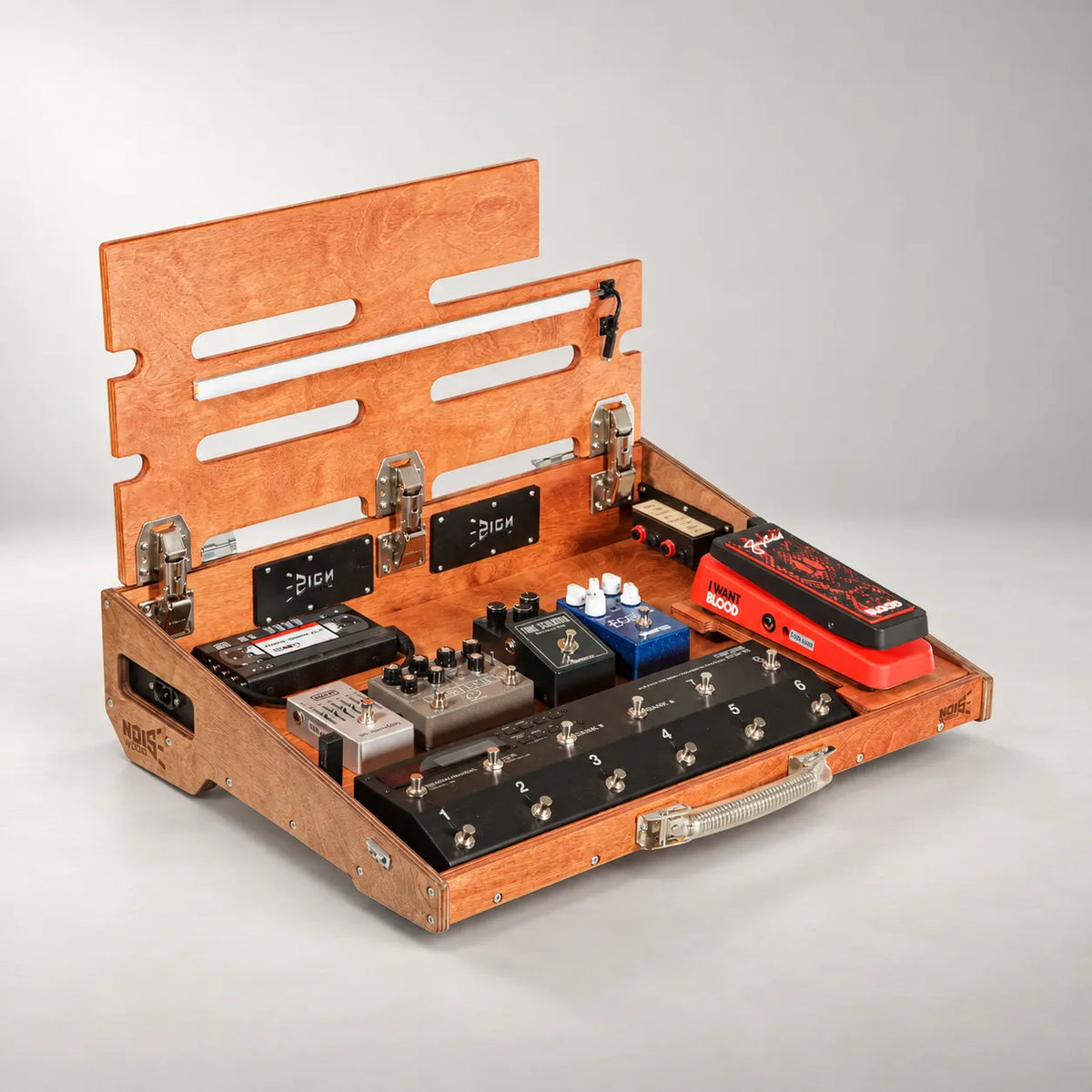 Noble D460/600 duo-colour pedalboard with the top deck lifted, showing the pedals stored underneath