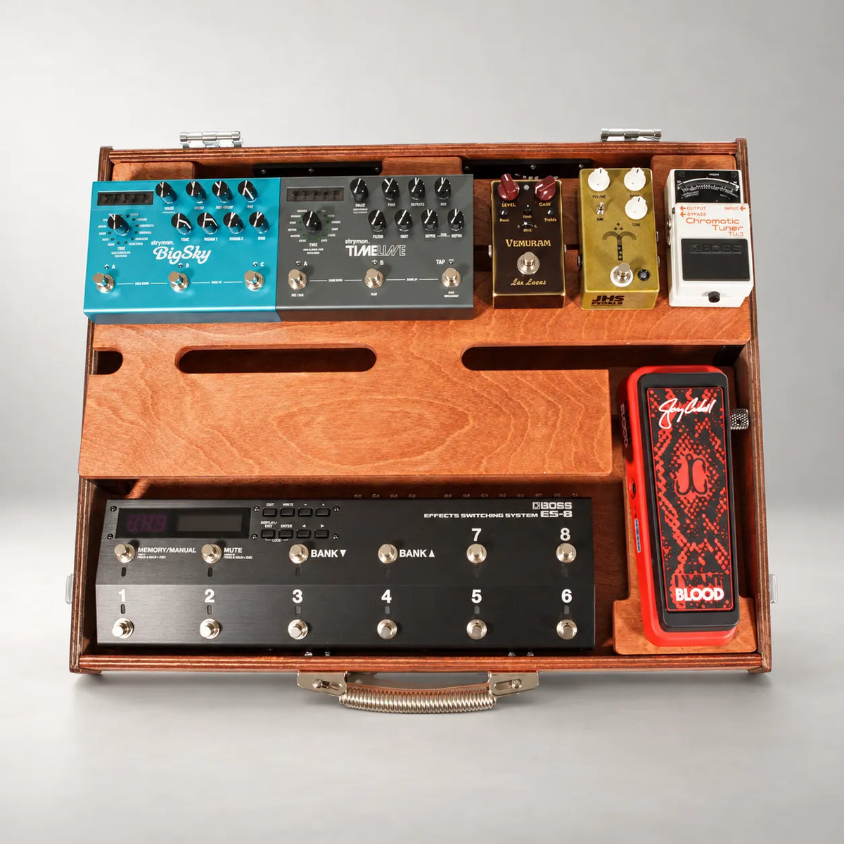Noble D460/600 duo-colour pedalboard seen from above, loaded with a switcher, boutique pedals and an expression pedal