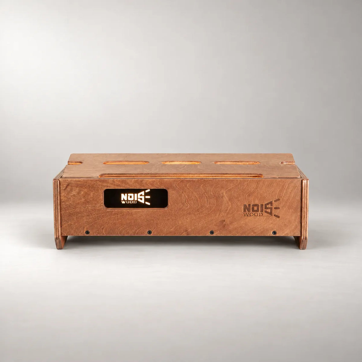 Illuminated Noisewood logo on the front panel of a Studio D340/450 Walnut pedalboard