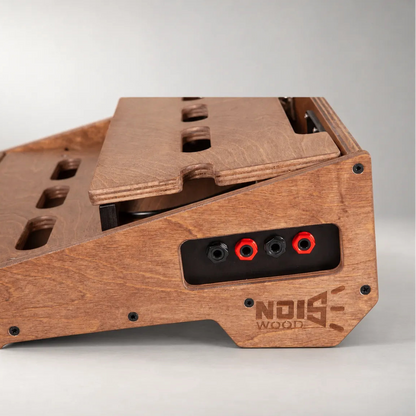 Four TRS jacks integrated in the stained side panel of a Studio D340/450 Walnut pedalboard