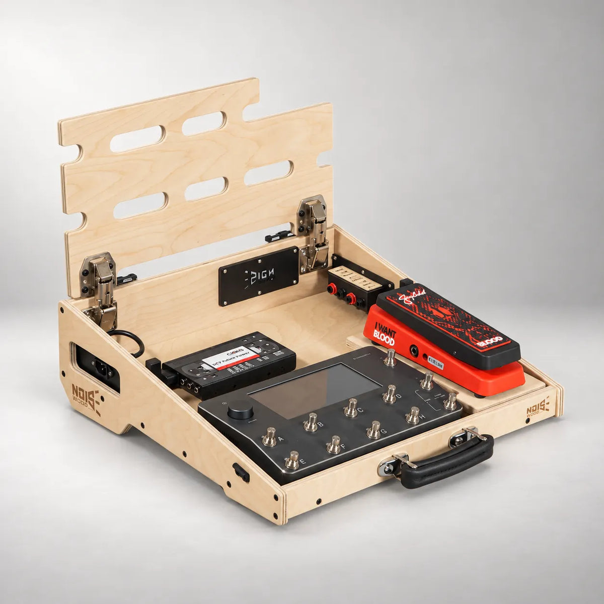 Tour D460/450 Natural Birch pedalboard with the top deck lifted, showing the power supply and pedals stored underneath